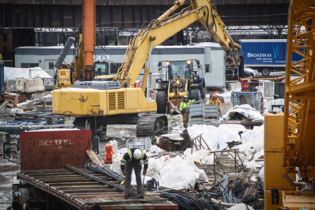 Workers are seen at the site of the Gateway Tunnel construction project in the Manhattan borough of New York City on February 10, 2026. According to US media reports, a federal judge has given the Trump administration until Thursday, February 12, 2026, to resume payments for the Gateway Tunnel project.  Last week, US President Donald Trump offered to unfreeze federal infrastructure funding if the top Senate Democrat would help rename a major airport and train station after him, US media reported. (Photo by Kena Betancur / AFP)