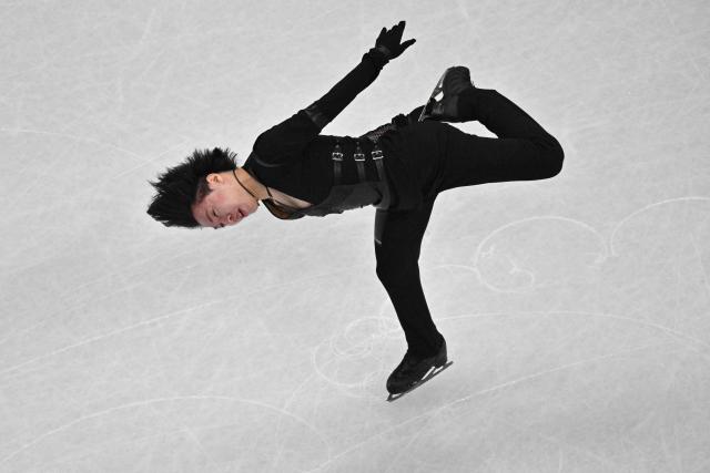 Japan's Kao Miura competes in the figure skating men's singles short program during the Milano Cortina 2026 Winter Olympic Games at Milano Ice Skating Arena in Milan on February 10, 2026. (Photo by Antonin THUILLIER / AFP)