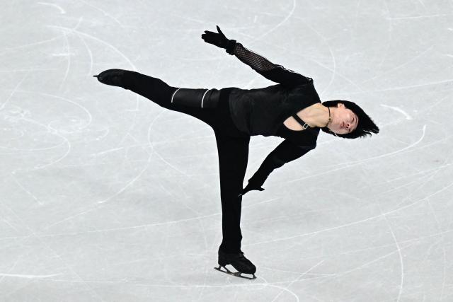 Japan's Kao Miura competes in the figure skating men's singles short program during the Milano Cortina 2026 Winter Olympic Games at Milano Ice Skating Arena in Milan on February 10, 2026. (Photo by JULIEN DE ROSA / AFP)