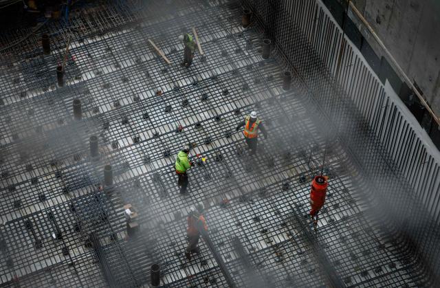 Workers are seen at the site of the Gateway Tunnel construction project in the Manhattan borough of New York City on February 10, 2026. According to US media reports, a federal judge has given the Trump administration until Thursday, February 12, 2026, to resume payments for the Gateway Tunnel project.  Last week, US President Donald Trump offered to unfreeze federal infrastructure funding if the top Senate Democrat would help rename a major airport and train station after him, US media reported. (Photo by Kena Betancur / AFP)