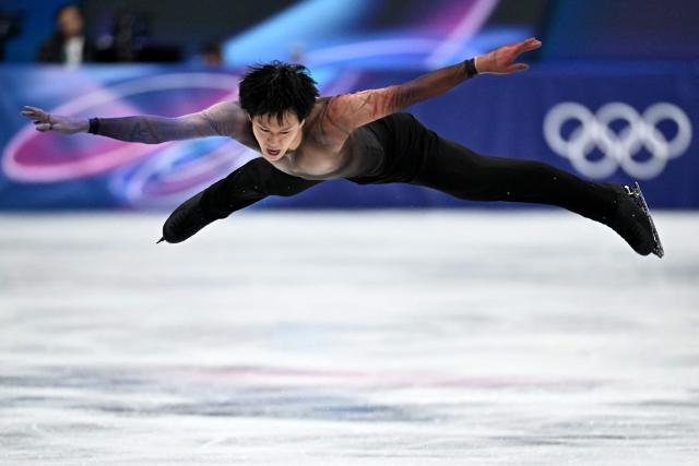 France's Adam Siao Him Fa competes in the figure skating men's singles short program during the Milano Cortina 2026 Winter Olympic Games at Milano Ice Skating Arena in Milan on February 10, 2026. (Photo by Gabriel BOUYS / AFP)