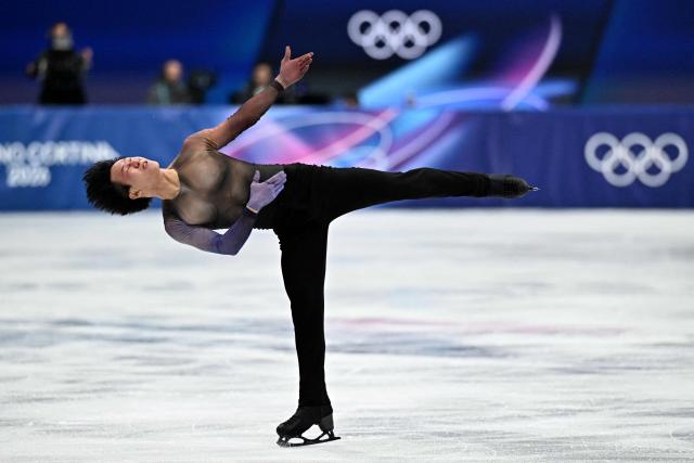 France's Adam Siao Him Fa competes in the figure skating men's singles short program during the Milano Cortina 2026 Winter Olympic Games at Milano Ice Skating Arena in Milan on February 10, 2026. (Photo by Gabriel BOUYS / AFP)