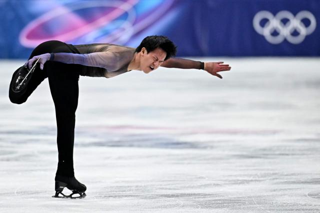 France's Adam Siao Him Fa competes in the figure skating men's singles short program during the Milano Cortina 2026 Winter Olympic Games at Milano Ice Skating Arena in Milan on February 10, 2026. (Photo by Gabriel BOUYS / AFP)