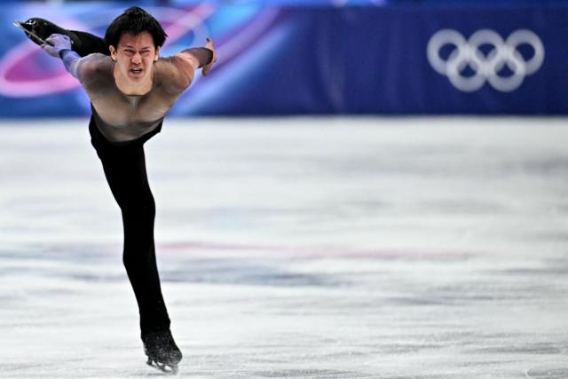 France's Adam Siao Him Fa competes in the figure skating men's singles short program during the Milano Cortina 2026 Winter Olympic Games at Milano Ice Skating Arena in Milan on February 10, 2026. (Photo by Gabriel BOUYS / AFP)