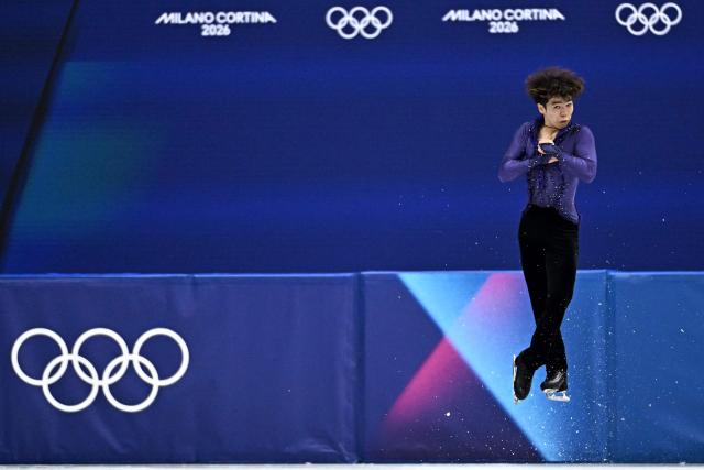 Japan's Shun Sato competes in the figure skating men's singles short program during the Milano Cortina 2026 Winter Olympic Games at Milano Ice Skating Arena in Milan on February 10, 2026. (Photo by Gabriel BOUYS / AFP)