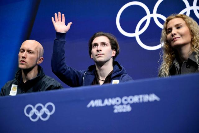 Georgia's Nika Egadze reacts at the kiss and cry area after competing in the figure skating men's singles short program during the Milano Cortina 2026 Winter Olympic Games at Milano Ice Skating Arena in Milan on February 10, 2026. (Photo by WANG Zhao / AFP)