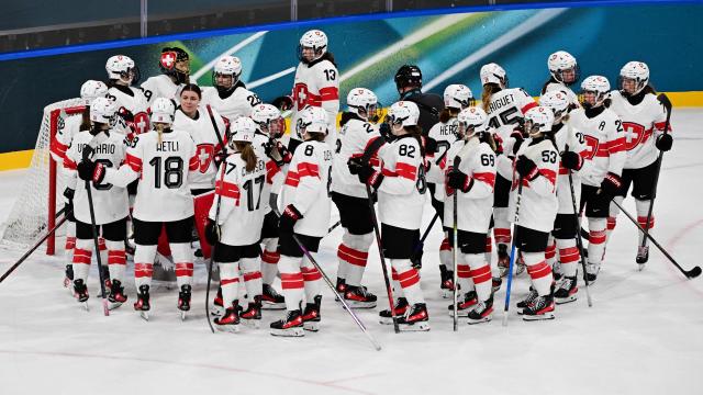 Switzerland's players react after the women's preliminary round Group A Ice Hockey match between Finland and Switzerland at the Milano Rho Ice Hockey Arena during the Milano Cortina 2026 Winter Olympic Games in Milan, on February 10, 2026. Finland won the match 3-1. (Photo by Piero CRUCIATTI / AFP)