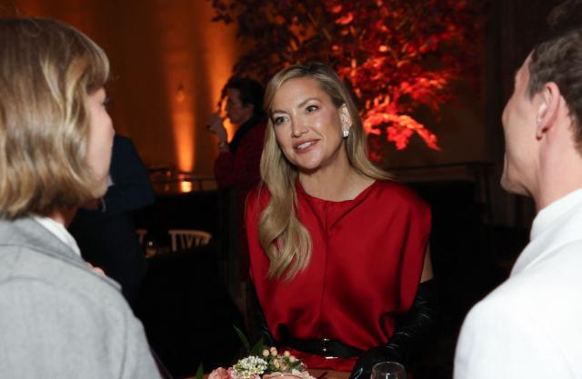 US actress Kate Hudson (C) speaks with writers directors Steve Pinter (R) and Julia Aks (L) as they attend the 98th Oscars Nominees Luncheon at the Beverly Hilton hotel in Beverly Hills, California on February 10, 2026. (Photo by Patrick T. FALLON / AFP)