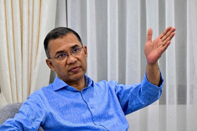 Bangladesh Nationalist Party (BNP) acting chairman and election candidate Tarique Rahman gestures as he speaks during an interview with AFP at the party's office in Dhaka on February 10, 2026. Bangladesh's leading prime ministerial hopeful Tarique Rahman said February 10 he faces "huge" challenges if he wins elections this week, vowing to repair a country he said was looted under the previous ousted government. (Photo by Munir UZ ZAMAN / AFP)