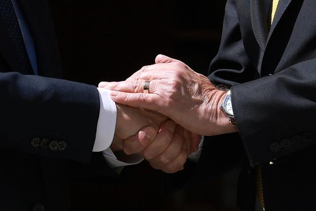 Australia's Prime Minister Anthony Albanese (R) receives Israel's President Isaac Herzo at the Parliament House in Canberra on February 11, 2026. Herzog's tightly secured, four-day trip aims to console Australia's Jewish community after the December shooting at Sydney's Bondi Beach that killed 15 people at a Hanukkah festival. (Photo by DAVID GRAY / AFP)