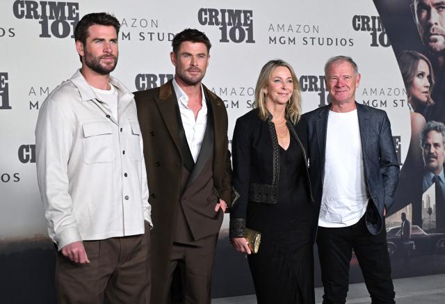 Australian actors Liam Hemsworth, Chris Hemsworth and parents Leonie Hemsworth and Craig Hemsworth attend the premiere of Amazon MGM Studios' "Crime 101" at The United Theatre in Los Angeles, on February 10, 2026. (Photo by LISA O'CONNOR / AFP)