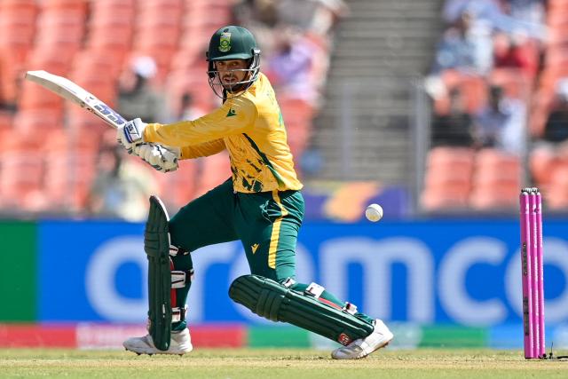 South Africa's Quinton de Kock plays a shot during the 2026 ICC Men's T20 Cricket World Cup group stage match between Afghanistan and South Africa at the Narendra Modi Stadium in Ahmedabad on February 11, 2026. (Photo by Shammi MEHRA / AFP)