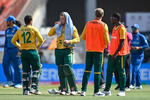 South Africa's Ryan Rickelton (2L) drinks water during the 2026 ICC Men's T20 Cricket World Cup group stage match between Afghanistan and South Africa at the Narendra Modi Stadium in Ahmedabad on February 11, 2026. (Photo by Shammi MEHRA / AFP)
