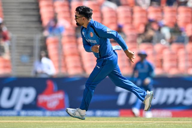 Afghanistan's captain Rashid Khan delivers a ball during the 2026 ICC Men's T20 Cricket World Cup group stage match between Afghanistan and South Africa at the Narendra Modi Stadium in Ahmedabad on February 11, 2026. (Photo by Shammi MEHRA / AFP)