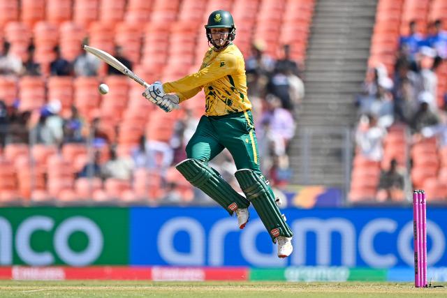 TOPSHOT - South Africa's Ryan Rickelton plays a shot during the 2026 ICC Men's T20 Cricket World Cup group stage match between Afghanistan and South Africa at the Narendra Modi Stadium in Ahmedabad on February 11, 2026. (Photo by Shammi MEHRA / AFP)
