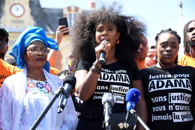 (FILES) Assa Traore (C), the sister of late Adama Traore, a man who died in police custody, delivers a speech next to her mother Oumou Traore (L) and sister Hawa ahead of a protest march to call for justice, on July 18, 2020 in Beaumont-sur-Oise, outside Paris. France's top court is to rule on February 11, 2026, on the dismissal of an investigation into the 2016 death of a young black man in police custody that sparked protests. (Photo by Bertrand GUAY / AFP)