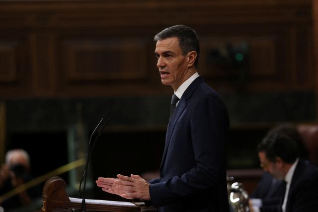 Spain's Prime minister Pedro Sanchez gestures as he addresses parliament over January train tragedy at the congress in Madrid on February 11, 2026. Two train accidents raised questions about Spanish rail safety and Spanish train drivers began a three-day strike. The collision of two high-speed trains in the southern region of Andalusia claimed 47 lives and a regional train accident in Catalunya killed one last month. (Photo by Pierre-Philippe MARCOU / AFP)