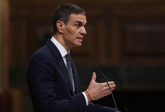Spain's Prime minister Pedro Sanchez gestures as he addresses parliament over January train tragedy at the congress in Madrid on February 11, 2026. Two train accidents raised questions about Spanish rail safety and Spanish train drivers began a three-day strike. The collision of two high-speed trains in the southern region of Andalusia claimed 47 lives and a regional train accident in Catalunya killed one last month. (Photo by Pierre-Philippe MARCOU / AFP)
