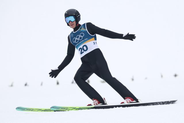 France's Laurent Muhlethaler lands after jumping during the ski jumping trial round of the nordic combined individual Gundersen normal hill/10km event at Predazzo Ski Jumping Stadium in Predazzo (Val di Fiemme) during the Milano Cortina 2026 Winter Olympic Games on February 11, 2026. (Photo by Anne-Christine POUJOULAT / AFP)