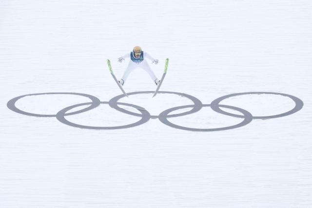 Norway's Jens Luraas Oftebro jumps during the ski jumping trial round of the nordic combined individual Gundersen normal hill/10km event at Predazzo Ski Jumping Stadium in Predazzo (Val di Fiemme) during the Milano Cortina 2026 Winter Olympic Games on February 11, 2026. (Photo by Anne-Christine POUJOULAT / AFP)