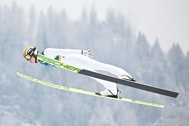 Norway's Jens Luraas Oftebro jumps during the ski jumping trial round of the nordic combined individual Gundersen normal hill/10km event at Predazzo Ski Jumping Stadium in Predazzo (Val di Fiemme) during the Milano Cortina 2026 Winter Olympic Games on February 11, 2026. (Photo by Tobias SCHWARZ / AFP)