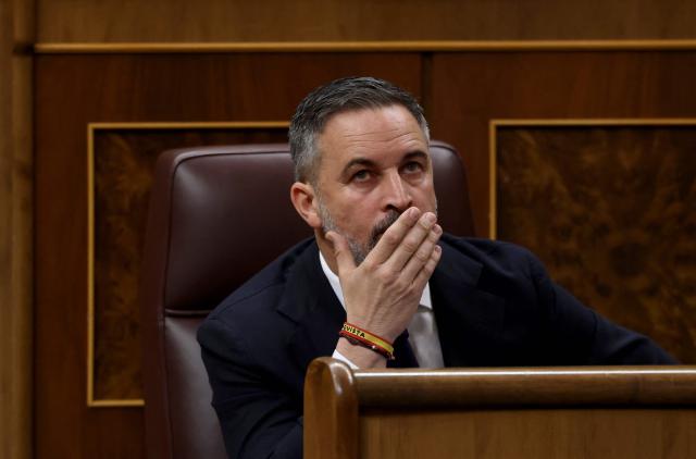 Spain's far-right party Vox leader Santiago Abascal looks on after Spain's Prime minister addressed parliament over January train tragedy at the congress in Madrid on February 11, 2026. Two train accidents raised questions about Spanish rail safety. The collision of two high-speed trains in the southern region of Andalusia claimed 46 lives and a regional train accident in Catalunya killed one last month. (Photo by Pierre-Philippe MARCOU / AFP)