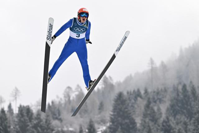 Kazakhstan's Chingiz Rakparov jumps in the competition round of the ski jumping of the nordic combined individual Gundersen normal hill/10km event at Predazzo Ski Jumping Stadium in Predazzo (Val di Fiemme) during the Milano Cortina 2026 Winter Olympic Games on February 11, 2026. (Photo by Javier SORIANO / AFP)