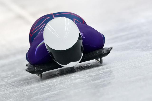 Britain's Tabitha Stoecker takes part in the skeleton women's training session at Cortina Sliding Centre during the Milano Cortina 2026 Winter Olympic Games in Cortina d'Ampezzo on February 11, 2026. (Photo by Stefano RELLANDINI / AFP)