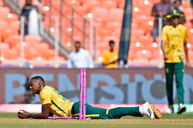 TOPSHOT - South Africa's Kagiso Rabada runs out Afghanistan's Noor Ahmad during the 2026 ICC Men's T20 Cricket World Cup group stage match between Afghanistan and South Africa at the Narendra Modi Stadium in Ahmedabad on February 11, 2026. (Photo by Shammi MEHRA / AFP)