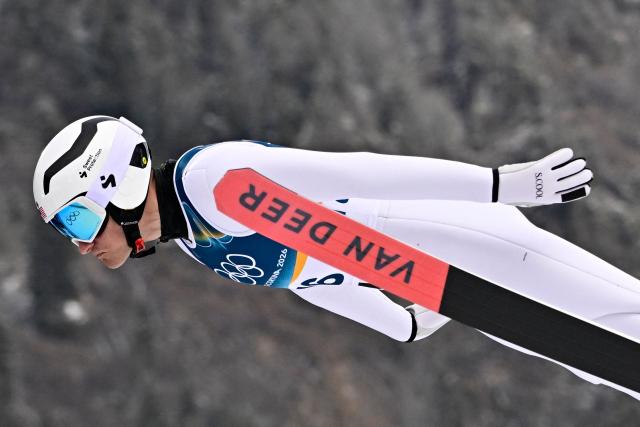 USA's Benjamin Loomis jumps in the competition round of the ski jumping of the nordic combined individual Gundersen normal hill/10km event at Predazzo Ski Jumping Stadium in Predazzo (Val di Fiemme) during the Milano Cortina 2026 Winter Olympic Games on February 11, 2026. (Photo by Tobias SCHWARZ / AFP)