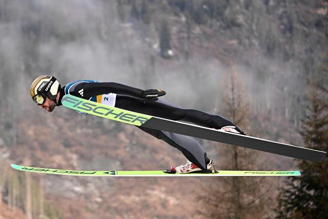 Germany's Johannes Rydzek jumps in the competition round of the ski jumping of the nordic combined individual Gundersen normal hill/10km event at Predazzo Ski Jumping Stadium in Predazzo (Val di Fiemme) during the Milano Cortina 2026 Winter Olympic Games on February 11, 2026. (Photo by Tobias SCHWARZ / AFP)