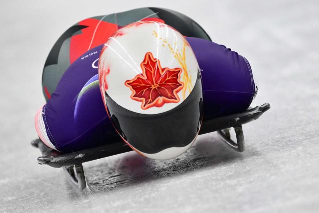 Canada's Hallie Clarke takes part in the skeleton women's training session at Cortina Sliding Centre during the Milano Cortina 2026 Winter Olympic Games in Cortina d'Ampezzo on February 11, 2026. (Photo by Stefano RELLANDINI / AFP)