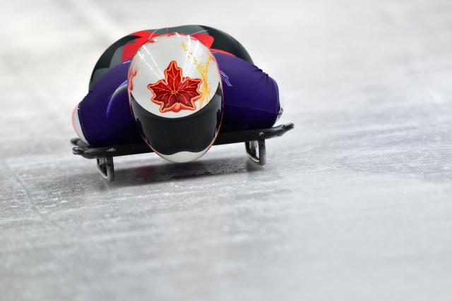 Canada's Hallie Clarke takes part in the skeleton women's training session at Cortina Sliding Centre during the Milano Cortina 2026 Winter Olympic Games in Cortina d'Ampezzo on February 11, 2026. (Photo by Stefano RELLANDINI / AFP)