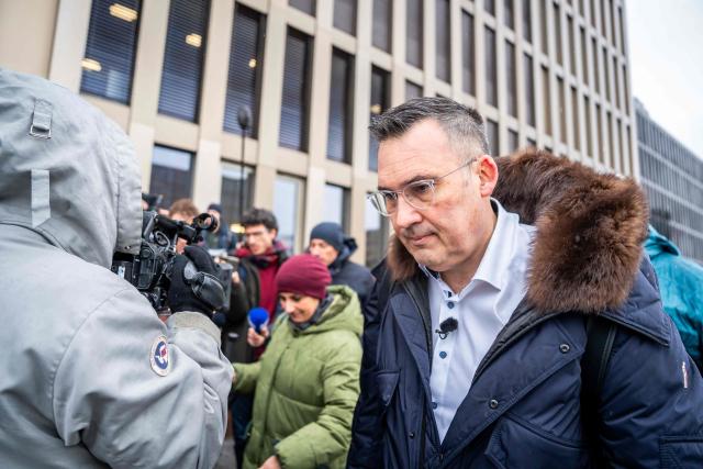 Sebastien Fanti, lawyer for several families of the victims arrives for a hearing at the Office of the public prosecutor of the Canton of Valais as part of the inquiry into a devastating New Year's fire, in Sion on February 11, 2026. 41 people, most of them teenagers, were killed, while 115 were injured in a fire that ripped through in Le Constellation bar in the Alpine ski resort of Crans-Montana on New Year's Eve. (Photo by Loic Micheloud / AFP)