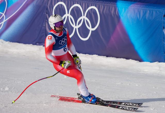 Switzerland's Alexis Monney reacts in the finish area of the men's super-G alpine skiing event during the Milano Cortina 2026 Winter Olympic Games at the Stelvio Ski Centre in Bormio (Valtellina) on February 11, 2026. (Photo by Dimitar DILKOFF / AFP)
