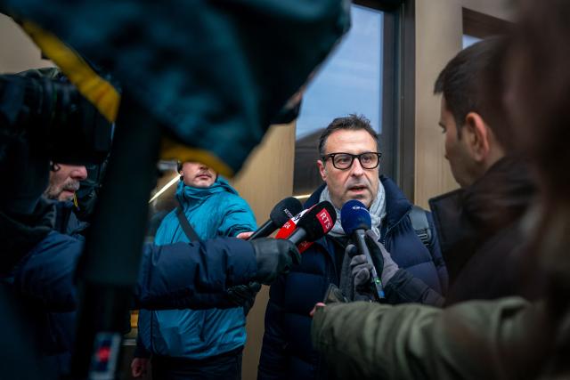 Fabrizio Ventimiglia, lawyer for some of the victims speaks to the press as he arrives for a hearing at the Office of the public prosecutor of the Canton of Valais as part of the inquiry into a devastating New Year's fire, in Sion on February 11, 2026. 41 people, most of them teenagers, were killed, while 115 were injured in a fire that ripped through in Le Constellation bar in the Alpine ski resort of Crans-Montana on New Year's Eve. (Photo by Loic Micheloud / AFP)