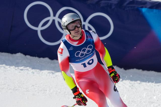 Switzerland's Marco Odermatt reacts in the finish area of the men's super-G alpine skiing event during the Milano Cortina 2026 Winter Olympic Games at the Stelvio Ski Centre in Bormio (Valtellina) on February 11, 2026. (Photo by Dimitar DILKOFF / AFP)