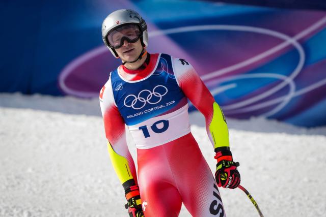 Switzerland's Marco Odermatt reacts in the finish area of the men's super-G alpine skiing event during the Milano Cortina 2026 Winter Olympic Games at the Stelvio Ski Centre in Bormio (Valtellina) on February 11, 2026. (Photo by Dimitar DILKOFF / AFP)