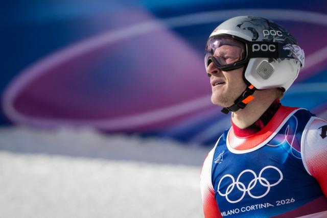 Switzerland's Marco Odermatt reacts in the finish area of the men's super-G alpine skiing event during the Milano Cortina 2026 Winter Olympic Games at the Stelvio Ski Centre in Bormio (Valtellina) on February 11, 2026. (Photo by Dimitar DILKOFF / AFP)