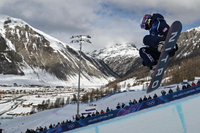 USA's Bea Kim competes in the snowboard women's halfpipe qualification run 2 during the Milano Cortina 2026 Winter Olympic Games at Livigno Snow Park, in Livigno (Valtellina), on February 11, 2026. (Photo by Jeff PACHOUD / AFP)