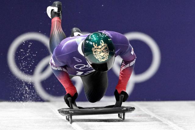 South Korea's Jung Seunggi takes part in the skeleton men's training session at Cortina Sliding Centre during the Milano Cortina 2026 Winter Olympic Games in Cortina d'Ampezzo on February 11, 2026. (Photo by Tiziana FABI / AFP)