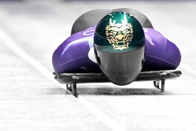 South Korea's Jung Seunggi takes part in the skeleton men's training session at Cortina Sliding Centre during the Milano Cortina 2026 Winter Olympic Games in Cortina d'Ampezzo on February 11, 2026. (Photo by Tiziana FABI / AFP)