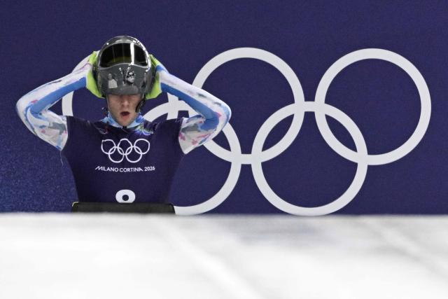 Ukraine's Vladyslav Heraskevych takes part in the skeleton men's training session at Cortina Sliding Centre during the Milano Cortina 2026 Winter Olympic Games in Cortina d'Ampezzo on February 11, 2026. (Photo by Tiziana FABI / AFP)