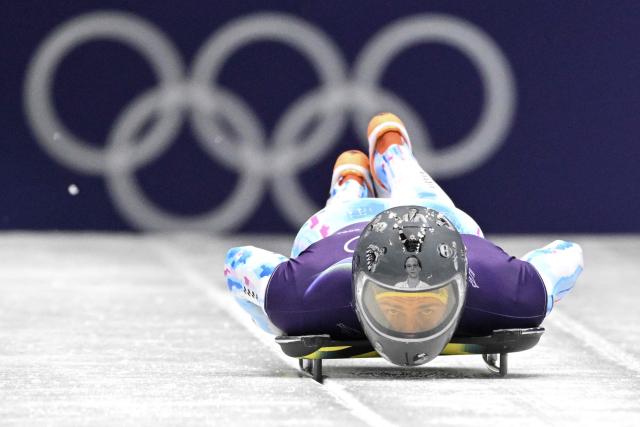 Ukraine's Vladyslav Heraskevych takes part in the skeleton men's training session at Cortina Sliding Centre during the Milano Cortina 2026 Winter Olympic Games in Cortina d'Ampezzo on February 11, 2026. (Photo by Tiziana FABI / AFP)