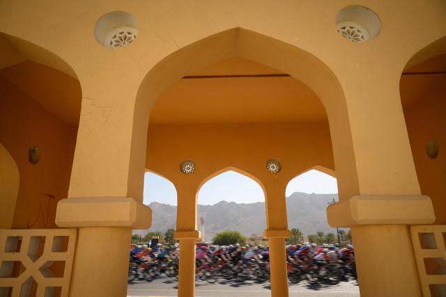 The pack rides during the 5th and last stage of the Tour of Oman cycling race from Nizwa to Green Mountain, on February 11, 2026. (Photo by Loic VENANCE / AFP)
