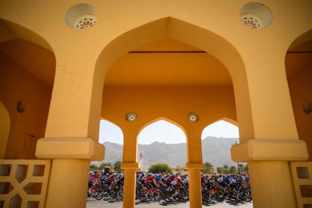 The pack rides during the 5th and last stage of the Tour of Oman cycling race from Nizwa to Green Mountain, on February 11, 2026. (Photo by Loic VENANCE / AFP)