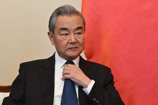 Chinese Foreign Minister Wang Yi attends a bilateral meeting with the Hungarian Foreign and Trade Minister in Budapest, Hungary, on February 11, 2026. (Photo by Attila KISBENEDEK / AFP)