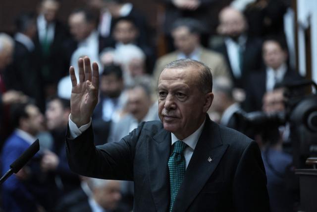 Turkish President and the leader of the Justice and Development Party (AKP) Recep Tayyip Erdogan gestures during his party's parliamentary group meeting at the Turkish Grand National Assembly in Ankara on February 11, 2025. (Photo by Adem ALTAN / AFP)