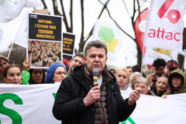 President of Medecins du monde Jean-François Corty speaks during a demonstration for agriculture, the environment and health, against the Duplomb law, at the initiative of dozens of NGOs and farmers' organizations, in front of the National Assembly in Paris on February 11, 2026. Senator Laurent Duplomb's law, adopted by Parliament in early July, facilitates water storage and the expansion of livestock buildings. But another measure concentrated indignation: the conditional reintroduction of acetamiprid, a pesticide from the neonicotinoid family banned in France but authorized elsewhere in Europe and accused of being a "bee killer" by its critics. (Photo by Guillaume BAPTISTE / AFP)
