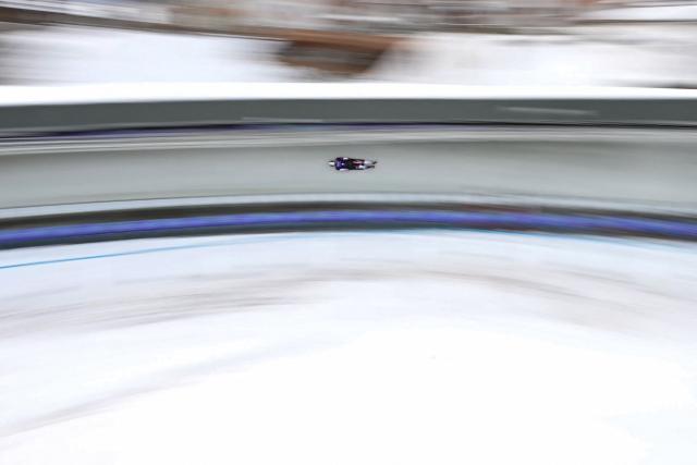 Latvia's Emils Indriksons takes part in the skeleton men's training session at Cortina Sliding Centre during the Milano Cortina 2026 Winter Olympic Games in Cortina d'Ampezzo on February 11, 2026. (Photo by Stefano RELLANDINI / AFP)